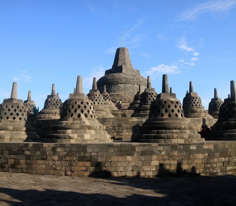 The main stupa surrounded by rows of smaller stupas, crowning the Borobudur Buddhist monument in Central Java, Indonesia. The largest Buddhist monument in the world, it was built in the 9th century by the Sailendra dynasty. The upper rounded terrace with rows of bell shaped stupas containing Buddha images symbolize Arupadhatu, the sphere of formlesness, a complete perfection of enlightenment.