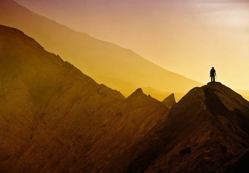 Silhouettes of tourists hiking on Bromo mountain