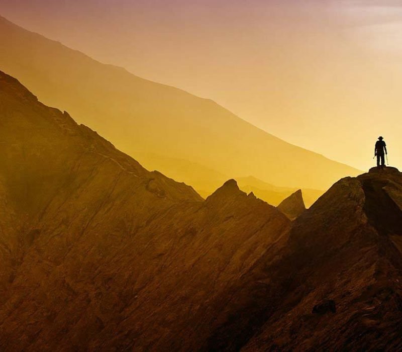 Silhouettes of tourists hiking on Bromo mountain